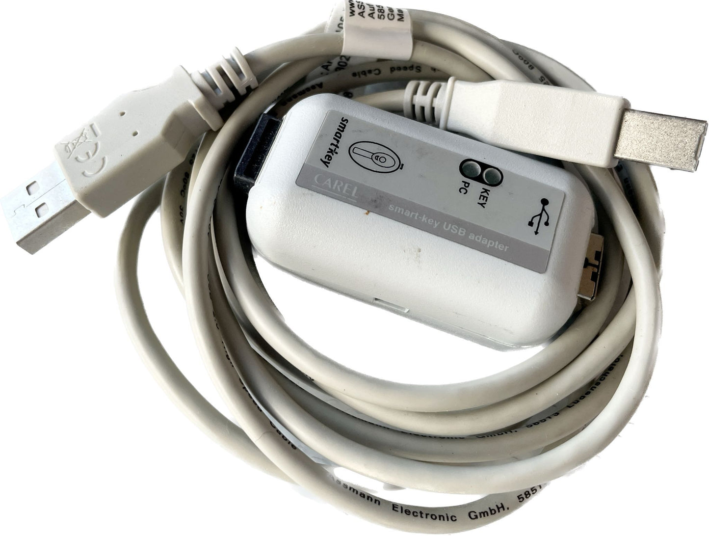 A USB key adapter with a dongle, featuring a white and grey color scheme, designed to connect to a computer.